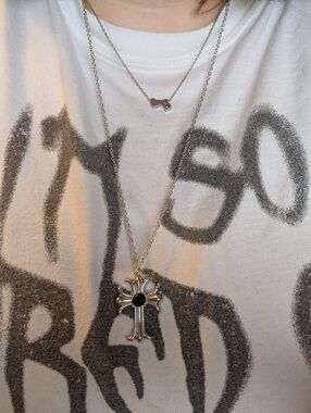 Silver Cross Pendant Necklace on White Graphic Tee